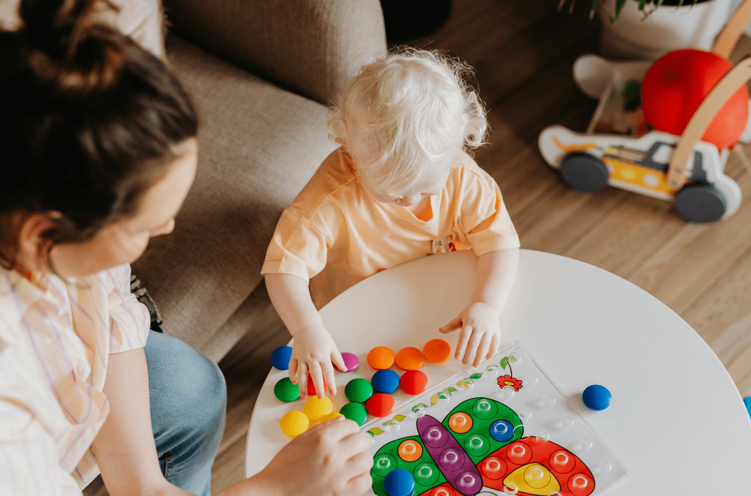 mother and child playing with colorful toys